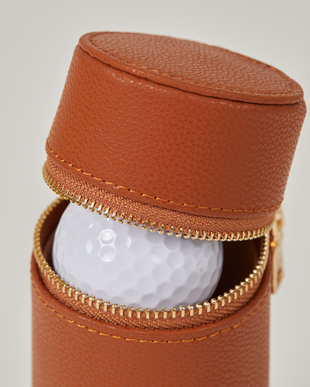 Golf ball inside leather golf ball holder