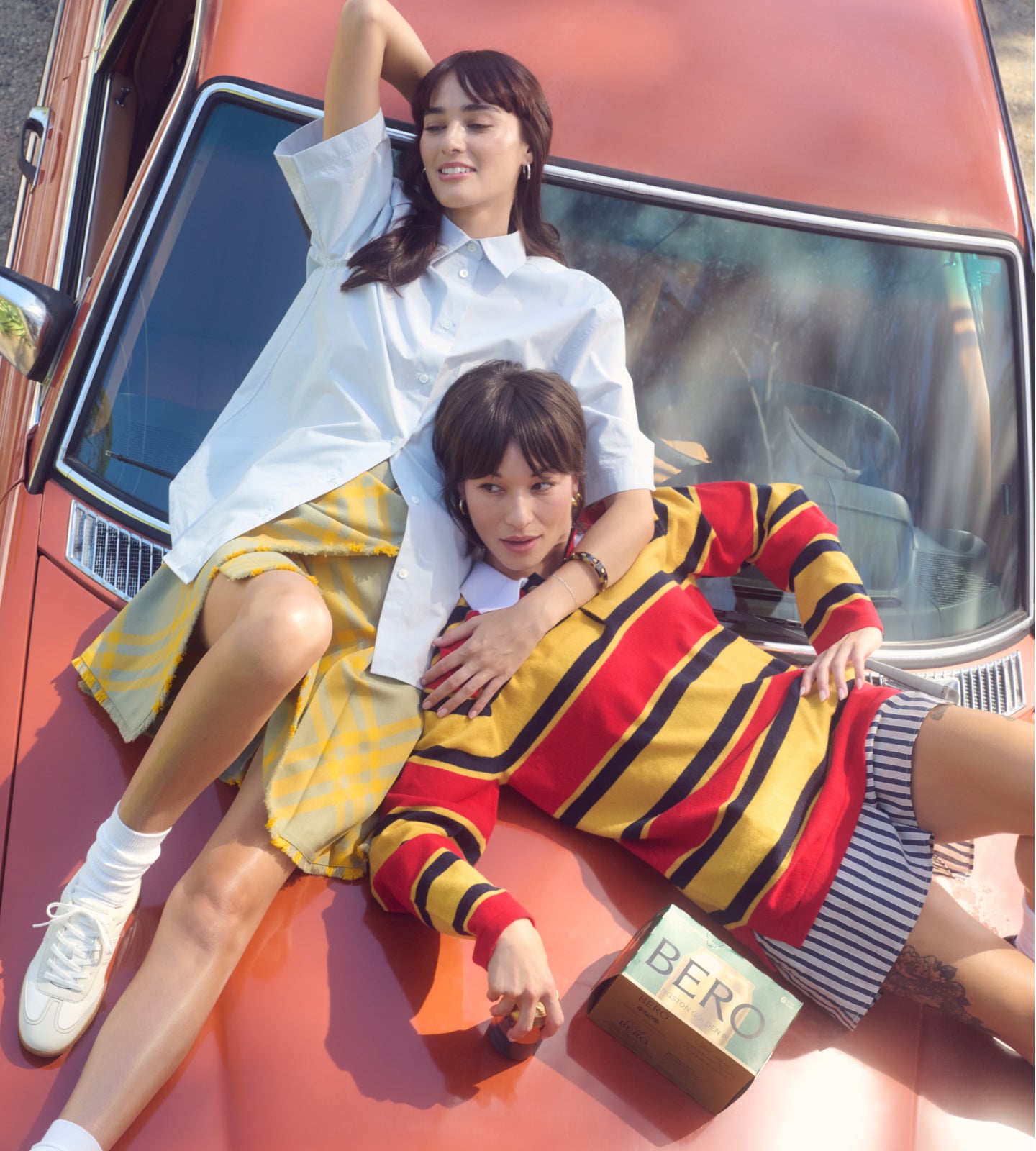 Friends on a car with cartons of BERO