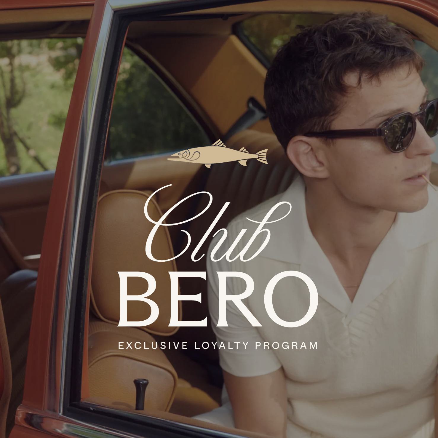 Tom Holland sitting in a car with "Club Bero Exclusive Loyalty Program"
