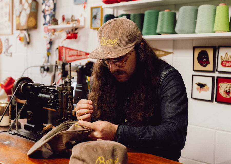 Giulio Miglietta working in his studio wearing a BERO hat