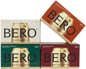 Four different cartons of BERO beer playfully stacked