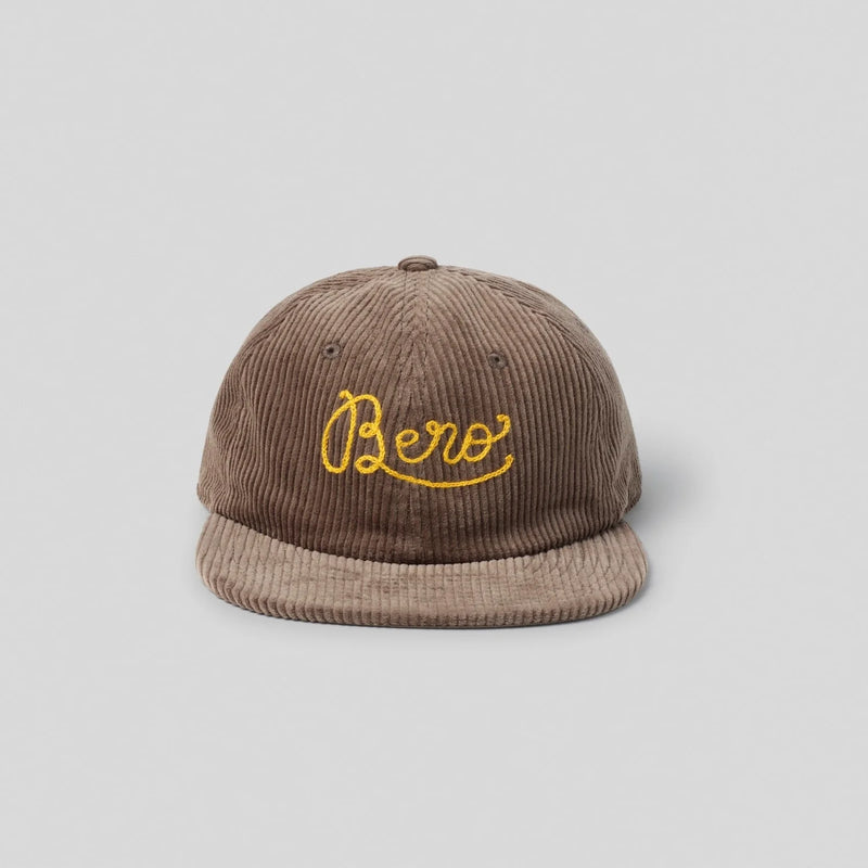 Brown corduroy baseball cap with yellow embroidered "BERO" script logo on front panel