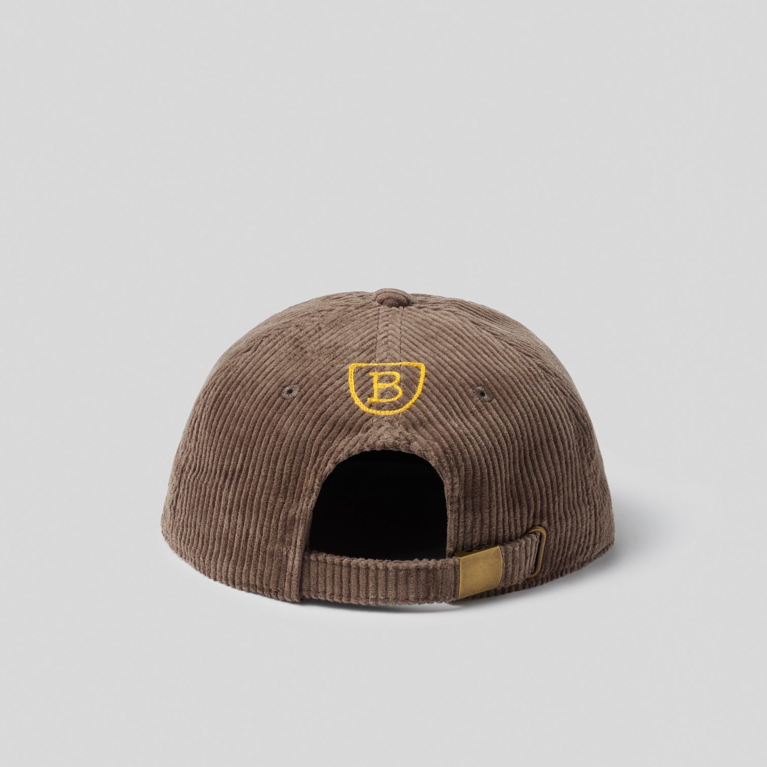 Back view of a brown corduroy cap with a yellow "B" logo 