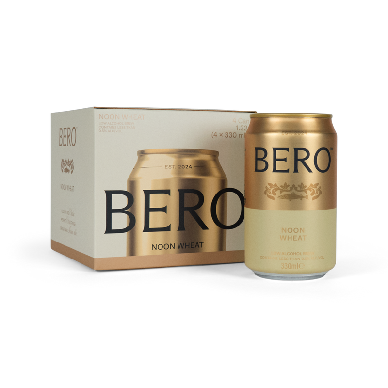 BERO Noon Wheat non-alcoholic beer can next to 4-pack box, featuring gold and cream packaging