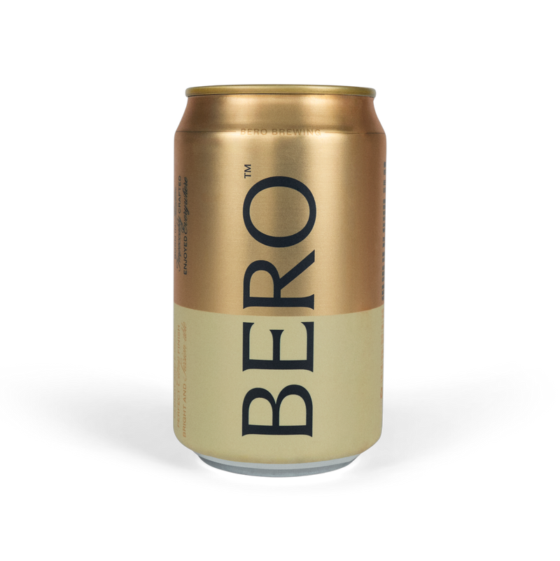 BERO Noon Wheat non-alcoholic beer can in gold and cream colors with black text on white background