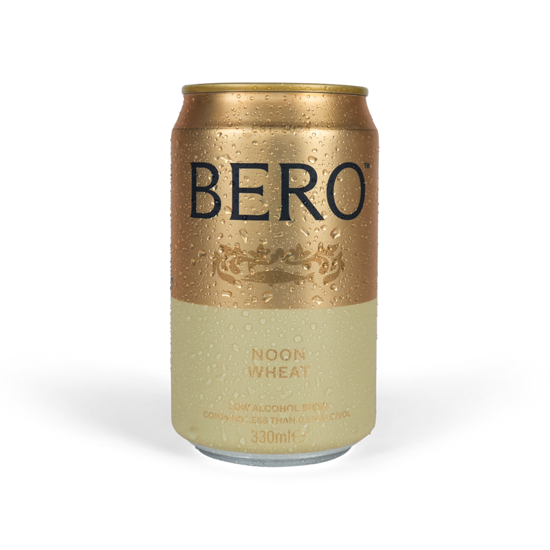 Golden BERO Noon Wheat non-alcoholic beer can with condensation droplets on white background