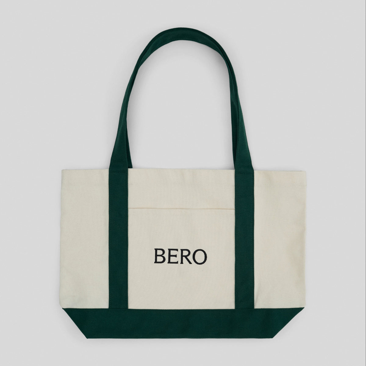 Tote bag with 'BERO' branding with green straps