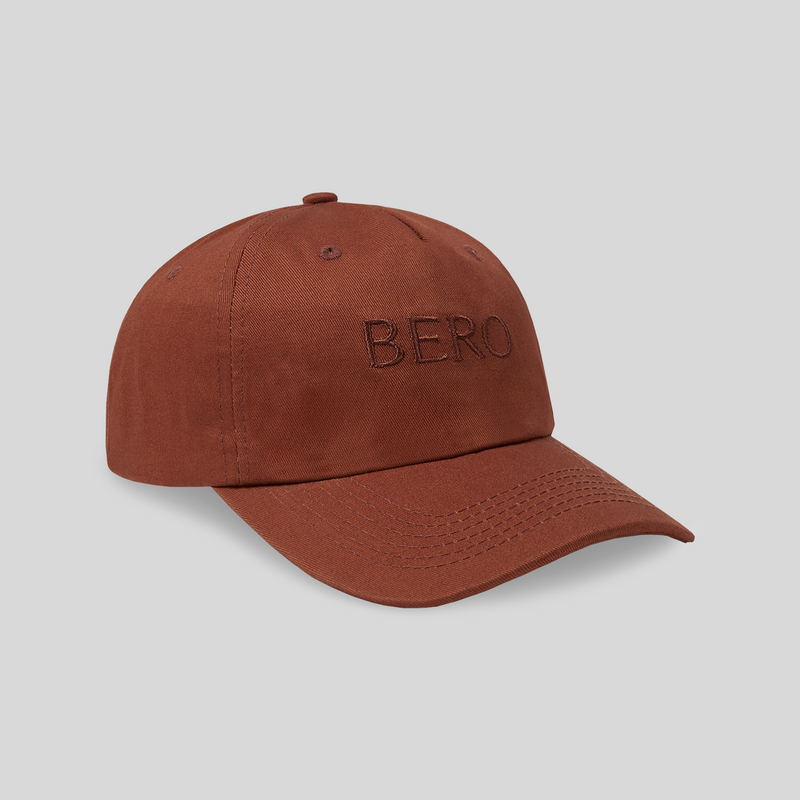 Rust-colored baseball cap with "BERO" embroidered on the front in matching thread