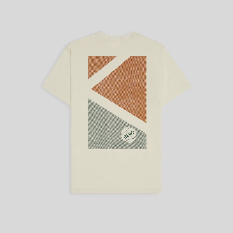 Cream-colored t-shirt with geometric orange and green diagonal pattern design featuring BERO logo
