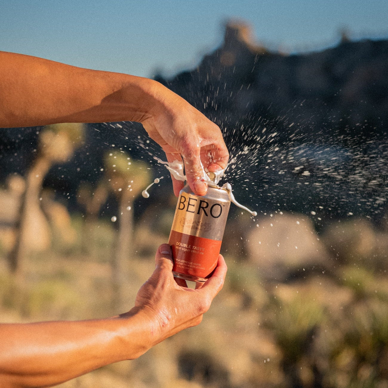 Person opening a can of Double Tasty