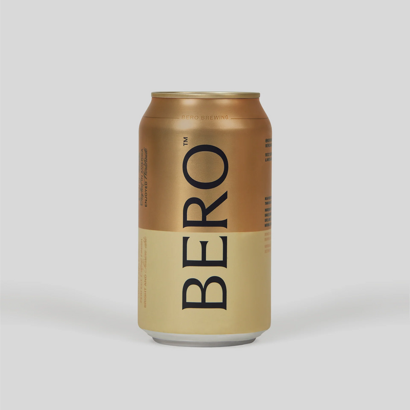 BERO Noon Wheat non-alcoholic beer can in gold and cream colors with black typography against light background