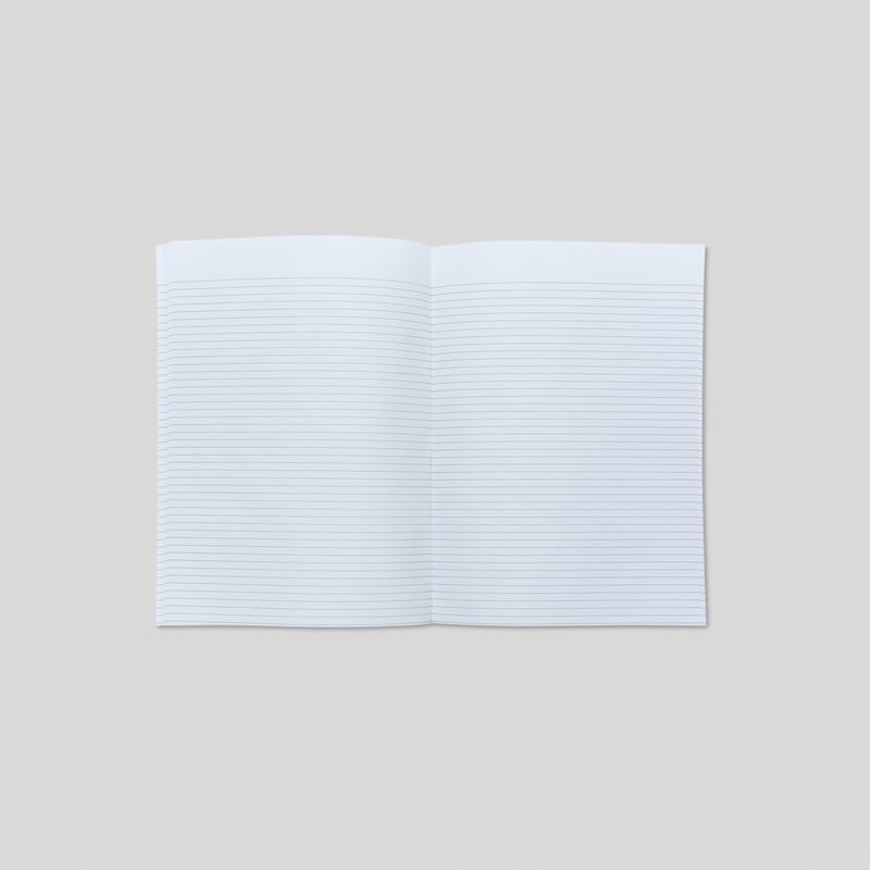 Open notebook with blank lined pages spread across two pages on a light gray background