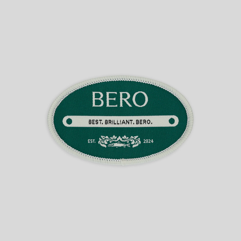 Green oval BERO patch with white border, "BEST. BRILLIANT. BERO." tagline and "EST. 2024