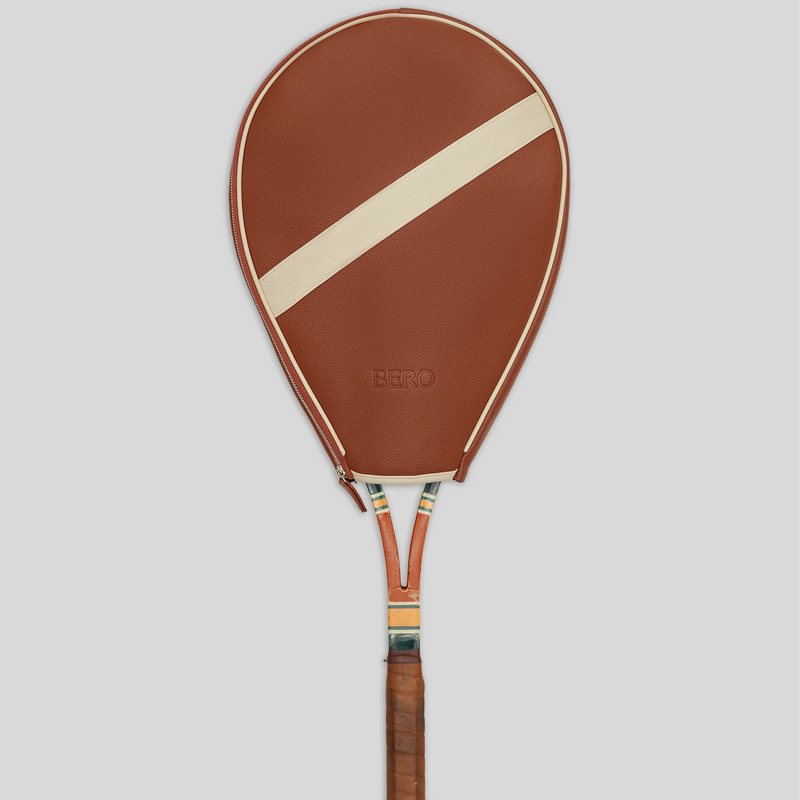 Brown leather tennis racquet cover with cream diagonal stripe and BERO branding