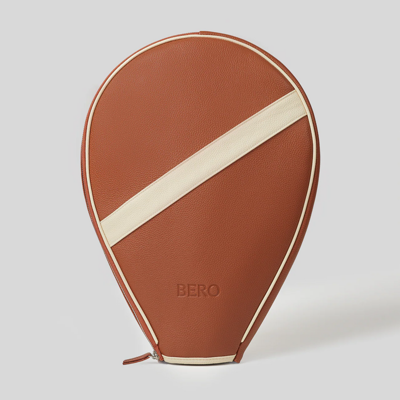Brown leather tennis racquet cover with cream accent stripe and BERO logo embossed on front