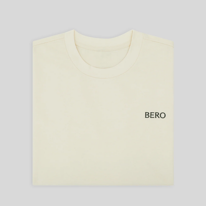 Cream-colored t-shirt with "BERO" text printed on the chest area against a light gray background